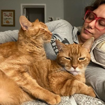 Picture of Deanne Russo with her cats.